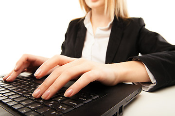 Image showing Woman hands typing on laptot, close-up, isolated