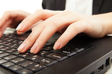 Image showing Woman hands typing on laptot, close-up, isolated