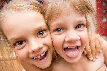 Image showing Close-up portrait of two girls five and seven years