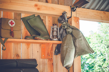 Image showing Retro survival kit in a wooden cabin