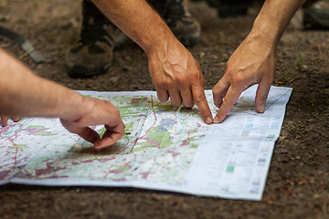 Image showing Navigating with map and compass