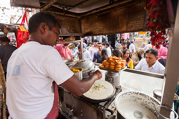 Image showing Street vendor preparing food