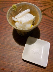 Image showing Slices of japanese octopus in a bowl with salt