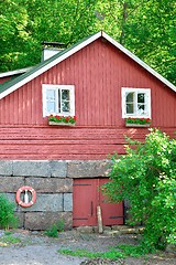 Image showing Wooden red coastal house in Finland