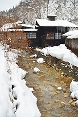 Image showing Small river by an rustic onsen 