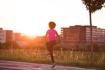 Image showing a young African American woman jogging outdoors