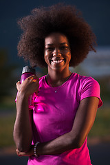 Image showing Portrait of a young african american woman running outdoors