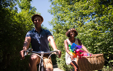 Image showing Young  couple having joyful bike ride in nature