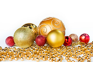 Image showing Gold Christmas balls on white