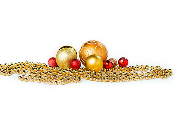 Image showing Gold Christmas balls on white
