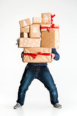 Image showing Gift boxes in the hands of young man