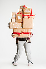 Image showing Gift boxes in the hands of young woman