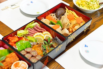 Image showing Osechi, traditional Japanese New Year food, in black lacqueware boxes