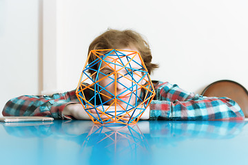 Image showing Young Man And The Volumetric Model Of Geometric Solid