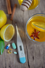 Image showing Hot lemon tea and pills 