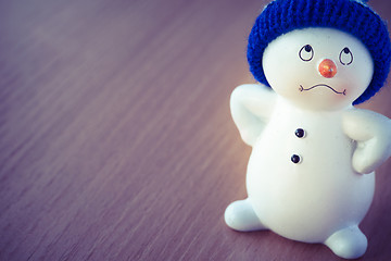 Image showing Cute Snowman on Wooden Table