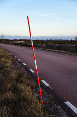 Image showing Snow stake by a roadside