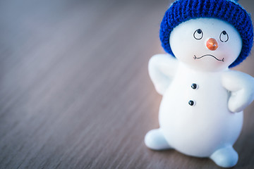 Image showing Cute Snowman on Wooden Table