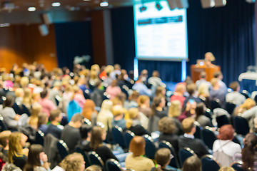 Image showing Blured image of audience in conference hall attending business symposium.