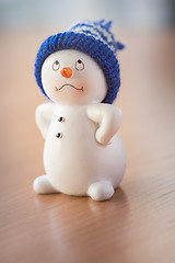 Image showing Cute Snowman on Wooden Table