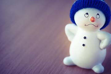 Image showing Cute Snowman on Wooden Table