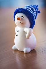 Image showing Cute Snowman on Wooden Table