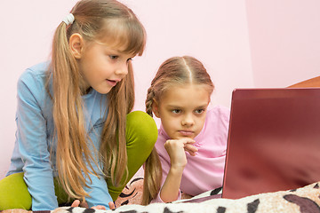 Image showing Sisters looking at a laptop cartoon