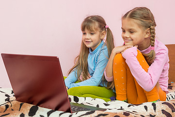 Image showing Sisters looking at a laptop cartoon