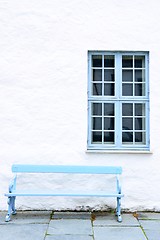 Image showing Light blue bench and window