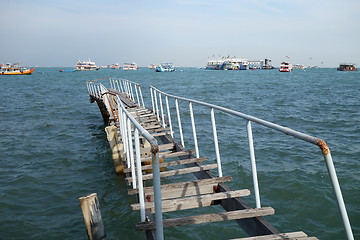 Image showing The wooden bridge extending into the sea