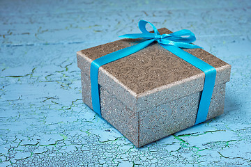 Image showing Gift box with blue ribbon