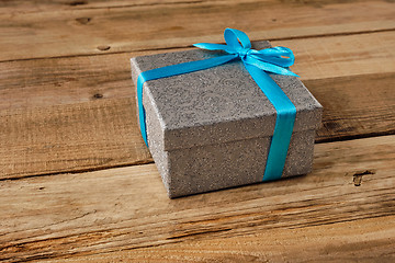 Image showing Gift box with blue ribbon