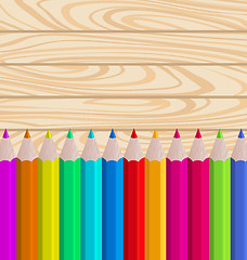 Image showing Palette Pencils on Wooden Background