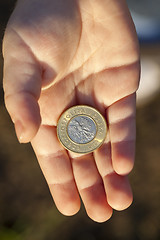 Image showing coin in the hands of a child