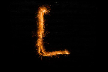 Image showing Letter L made of sparklers on black