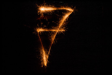 Image showing Number 7 made of sparklers on black