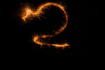 Image showing Number 2 made of sparklers on black