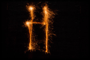 Image showing Letter H made of sparklers on black