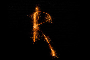 Image showing Letter R made of sparklers on black