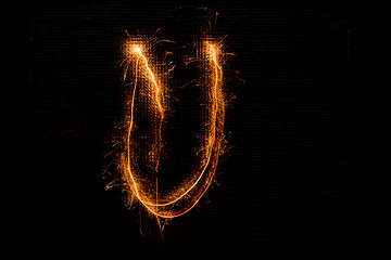 Image showing Letter U made of sparklers on black