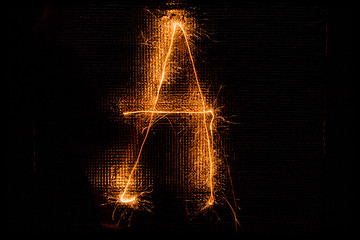 Image showing Letter A made of sparklers on black