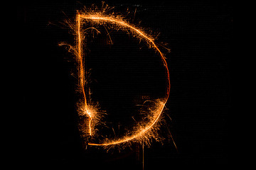 Image showing Letter D made of sparklers on black