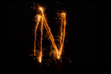 Image showing Letter N made of sparklers on black