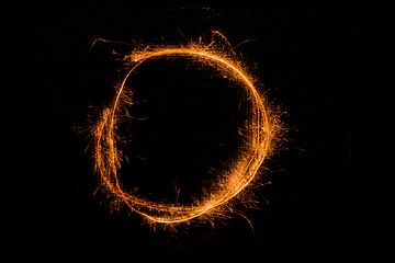 Image showing Letter O made of sparklers on black