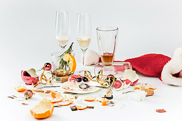 Image showing The morning after christmas day, table with alcohol and leftovers