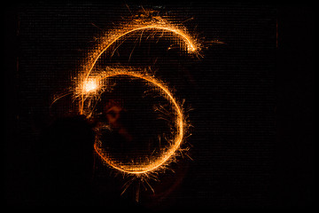 Image showing Number 6 made of sparklers on black