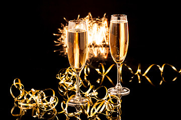 Image showing Glasses with champagne against holiday lights