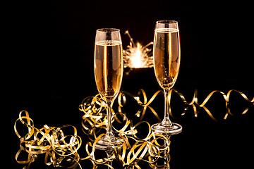 Image showing Glasses with champagne against holiday lights