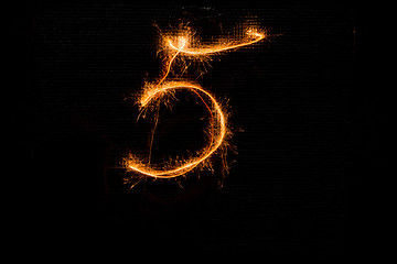 Image showing Number 5 made of sparklers on black