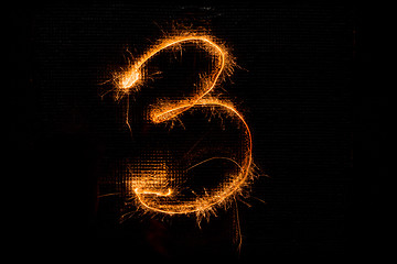 Image showing Number 3 made of sparklers on black